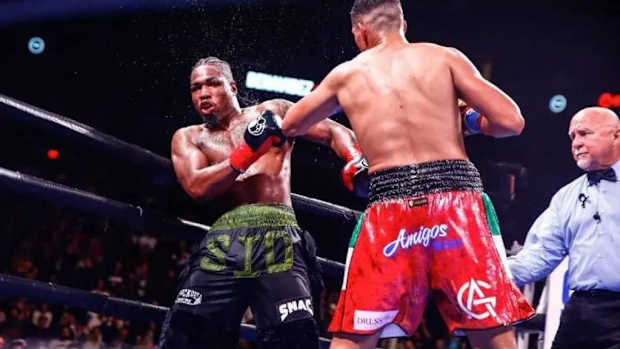 Kyrone Davis(L) and  David El Bandera Roja Benavidez exchange punches during their 12 round super middleweight bout in Phoenix, AZ. On Saturday, March 30, from T-Mobile Arena in Las Vegas, Kyrone Davis will square off against Elijah Garcia. ALEJANDRO SALAZAR/PXIMAGES/ICON SPORTSWIRE VIA GETTY IMAGES.